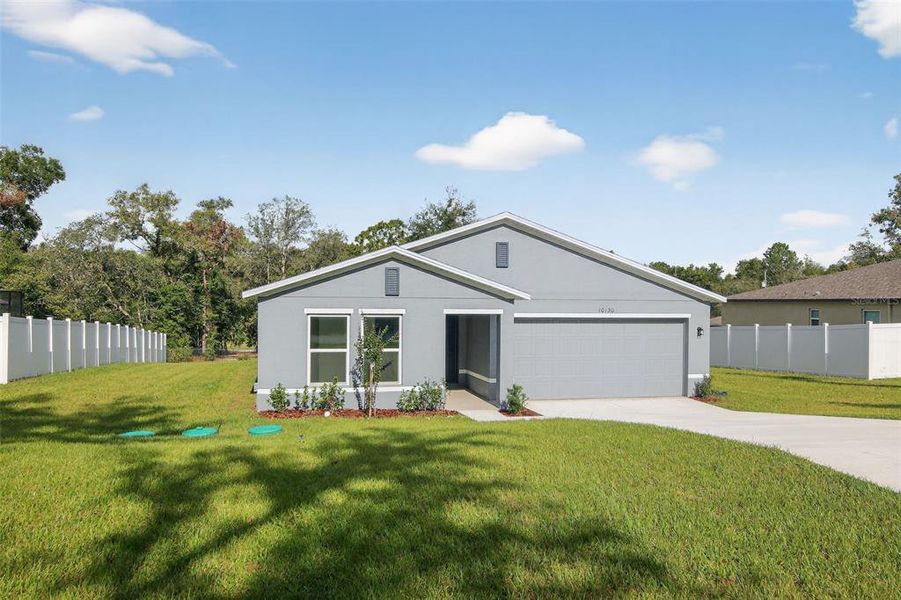 Front exterior of a new home in Citrus Springs, Citrus Springs, FL, highlighting curb appeal (Image 1). Front exterior of a new home in Citrus Springs, Citrus Springs, FL, highlighting curb appeal (Image 1).