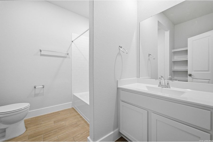 Furnished interior view inside a new home in The Woodlands at Medina Hills, Mico (Image 14).