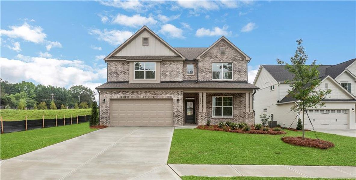Front exterior of a new home in , Loganville, GA, highlighting curb appeal (Image 23).