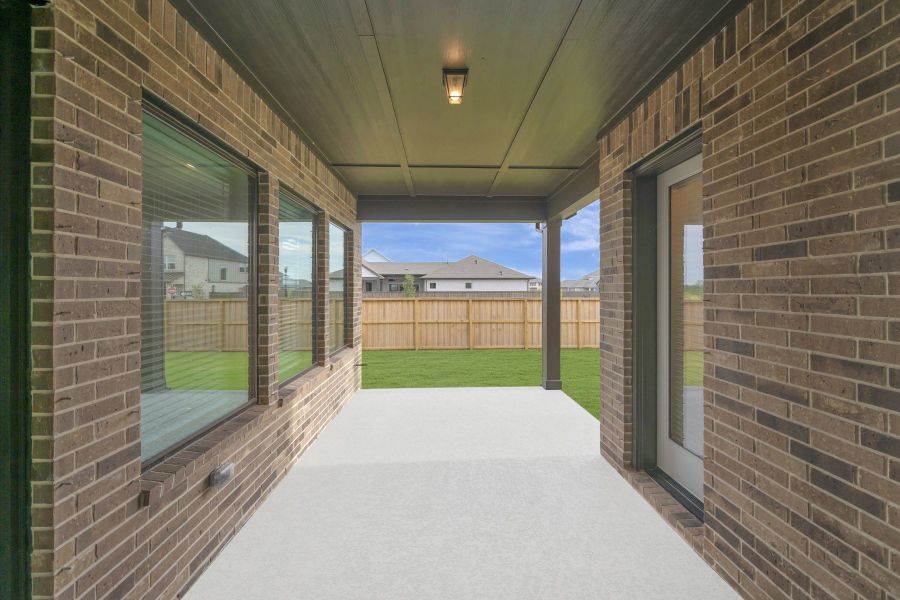 Exterior details and patio area of a home in Riceland - Enclave Row Collection, Mont Belvieu (Image 4).