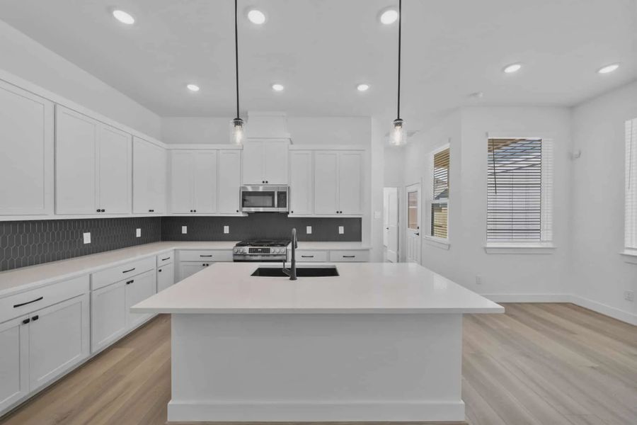Representative furnished interior of a home built from the Versailles by Chesmar Homes in Meridiana Chateau, Manvel (Image 6).