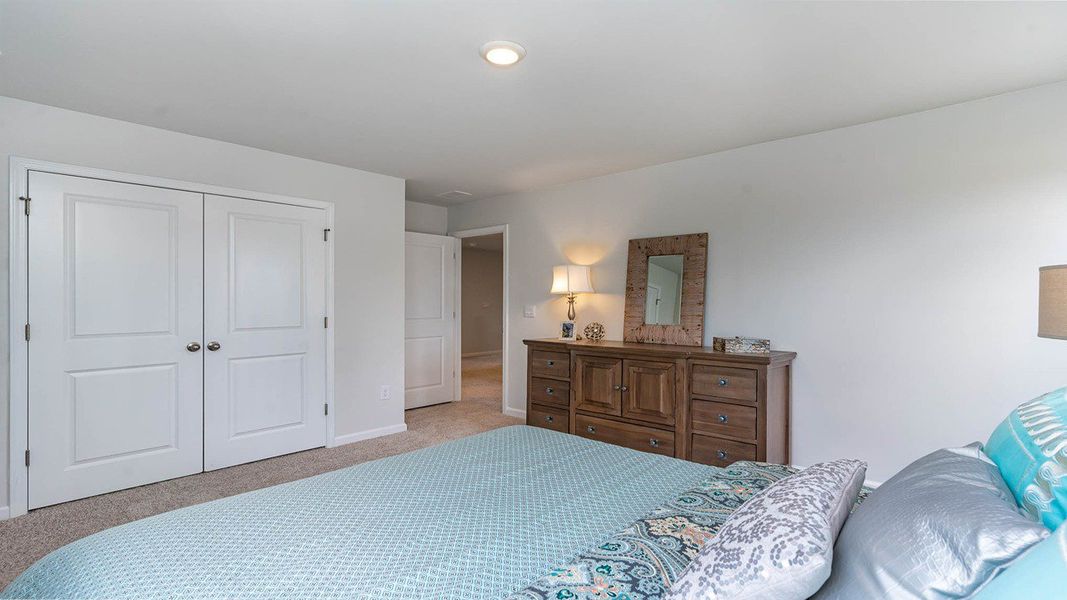Representative furnished interior of a home built from the TILLMAN by D.R. Horton in Spring View Landing, Loris (Image 28).