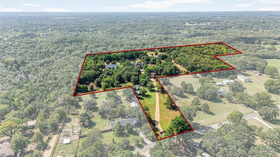 View of property location featuring property boundaries highlighted and a heavily wooded area View of property location featuring property boundaries highlighted and a heavily wooded area