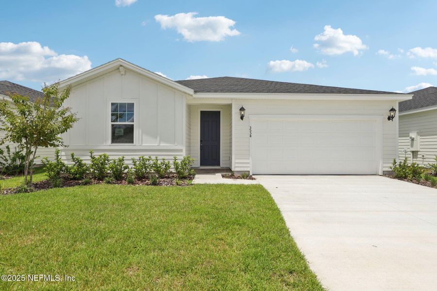 Front exterior of a new home in Lakes at Bella Lago - Signature Series, Green Cove Springs, FL, highlighting curb appeal (Image 15). Front exterior of a new home in Lakes at Bella Lago - Signature Series, Green Cove Springs, FL, highlighting curb appeal (Image 15).