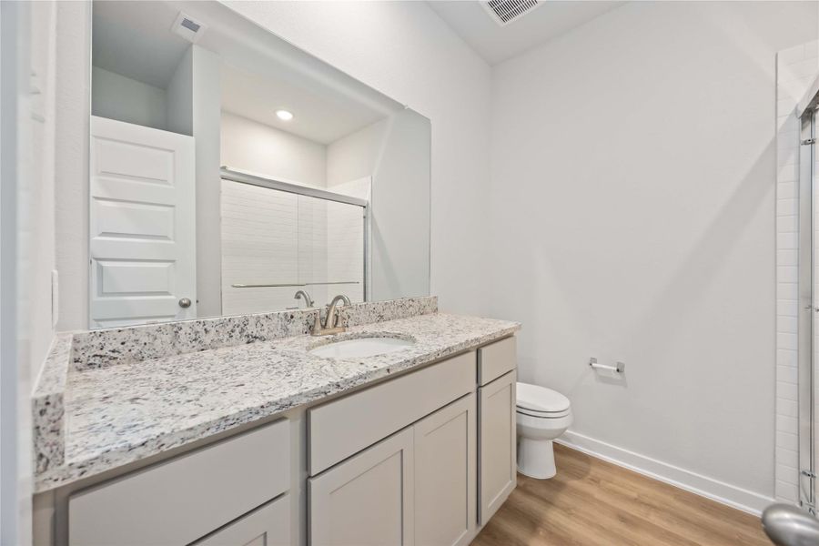 Elegant secondary bath with modern details and timeless style. Elegant secondary bath with modern details and timeless style.