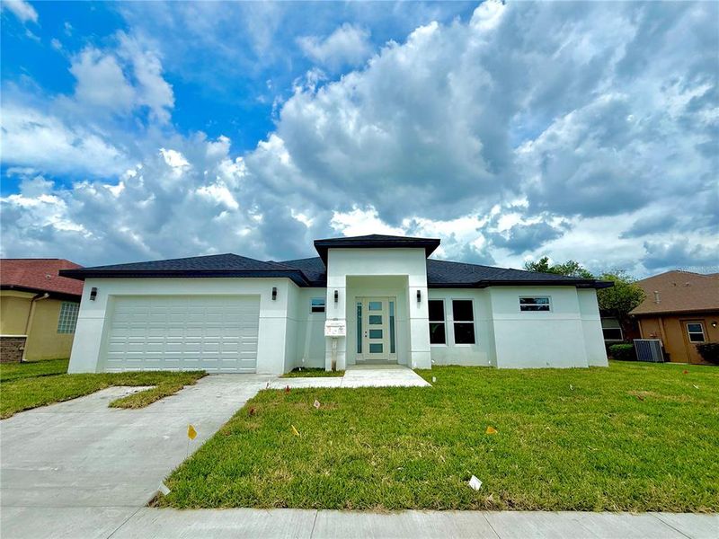 Front exterior of a new home in , Brooksville, FL, highlighting curb appeal (Image 2).