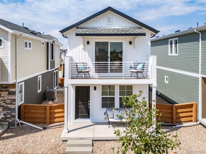 Front exterior of a new home in Reunion, Commerce City, CO, highlighting curb appeal (Image 21).