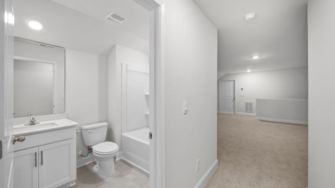 Furnished interior view inside a new home in Villa Grande, Winterville (Image 11).