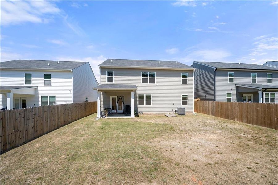 Front exterior of a new home in Summerwind, Dacula, GA, highlighting curb appeal (Image 1).