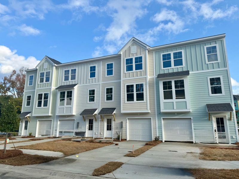Front exterior of a new home in Indigo Grove Townhomes, Johns Island, SC, highlighting curb appeal (Image 1).