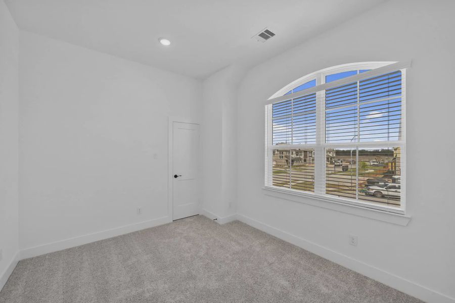 Representative unfurnished interior of a home built from the Versailles by Chesmar Homes in Meridiana Chateau, Manvel (Image 46).