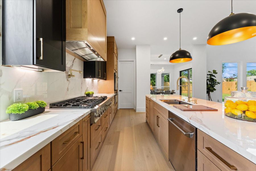 Experience culinary excellence in this luxury kitchen featuring professional-grade appliances and elegant, soft-close cabinetry. Experience culinary excellence in this luxury kitchen featuring professional-grade appliances and elegant, soft-close cabinetry.