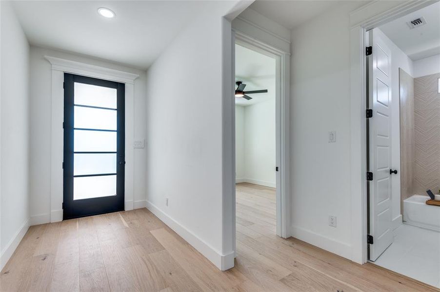 Foyer featuring light wood-style flooring and a ceiling fan