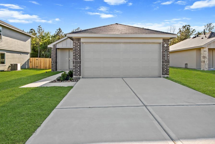 Front exterior of a new home in Porters Mill, New Caney, TX, highlighting curb appeal (Image 1). Front exterior of a new home in Porters Mill, New Caney, TX, highlighting curb appeal (Image 1).