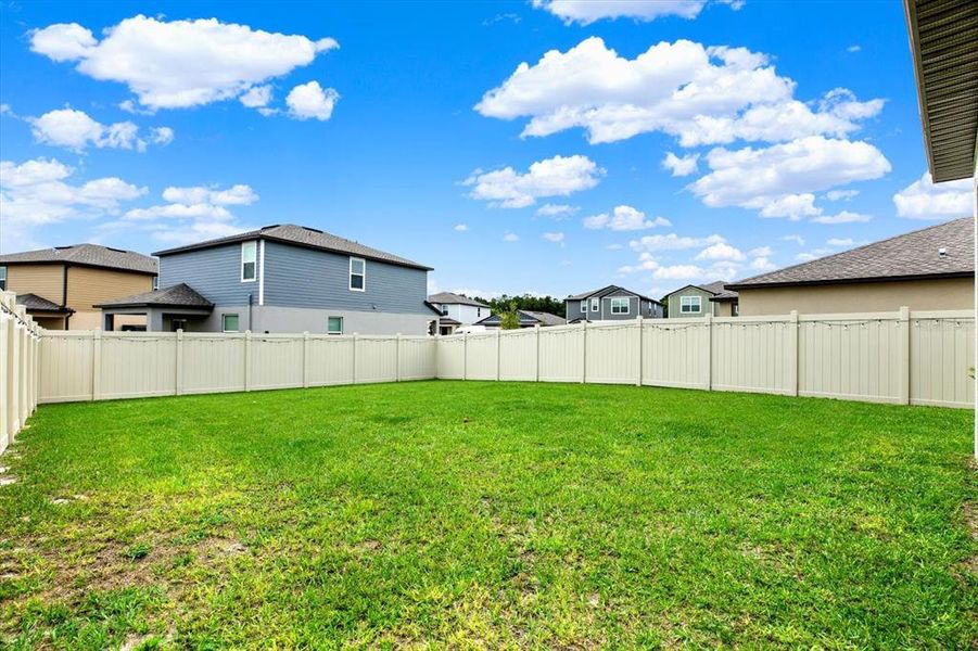 Front exterior of a new home in Two Rivers: The Manors II, Zephyrhills, FL, highlighting curb appeal (Image 25). Front exterior of a new home in Two Rivers: The Manors II, Zephyrhills, FL, highlighting curb appeal (Image 25).