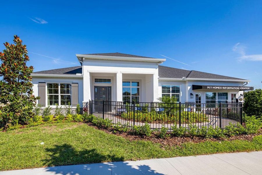 Front exterior of a new home in Ravencliffe, Oviedo, FL, highlighting curb appeal (Image 20).