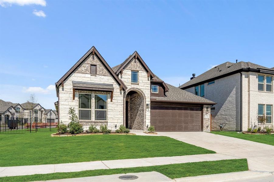 Front exterior of a new home in Willow Wood Classic 50, McKinney, TX, highlighting curb appeal (Image 1). Front exterior of a new home in Willow Wood Classic 50, McKinney, TX, highlighting curb appeal (Image 1).