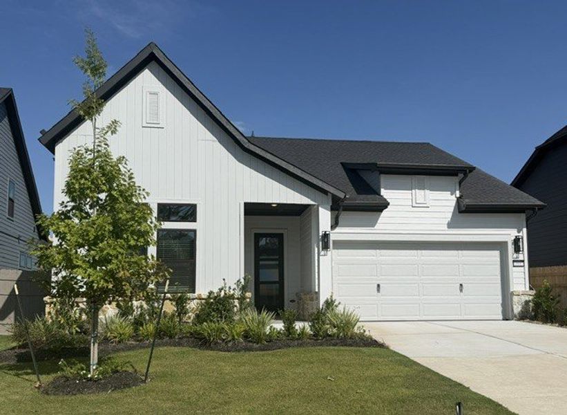 Front exterior of a new home in ARTAVIA - Enclave Collection, Conroe, TX, highlighting curb appeal (Image 2).