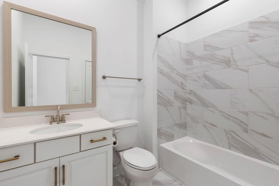 The two secondary bedrooms share this bathroom.