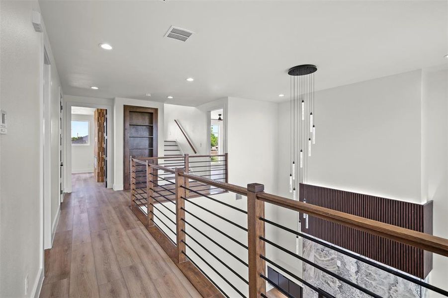 The property features light-colored walls, recessed lighting, and a chandelier with multiple light sources The property features light-colored walls, recessed lighting, and a chandelier with multiple light sources