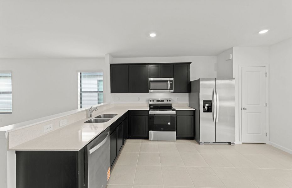 Furnished interior view inside a new home in Caloosa Cove, Labelle (Image 7).