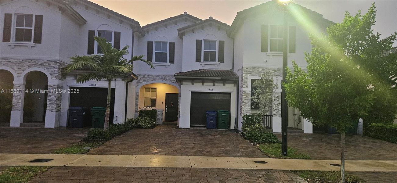 Front exterior of a new home in , Miami, FL, highlighting curb appeal (Image 12).
