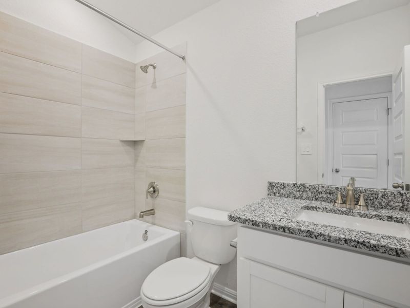 Furnished interior view inside a new home in Big Sky Ranch - Reserve Collection, Dripping Springs (Image 8).