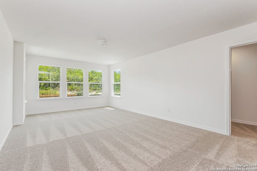 Spacious, unfurnished interior of a new home in Hidden Bluffs at TRP, San Antonio (Image 4).