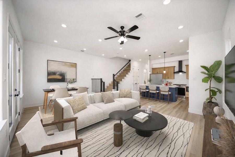 Spacious open-concept living with seamless flow to dining and kitchen areas. Bright, modern design ideal for both everyday living and entertaining.