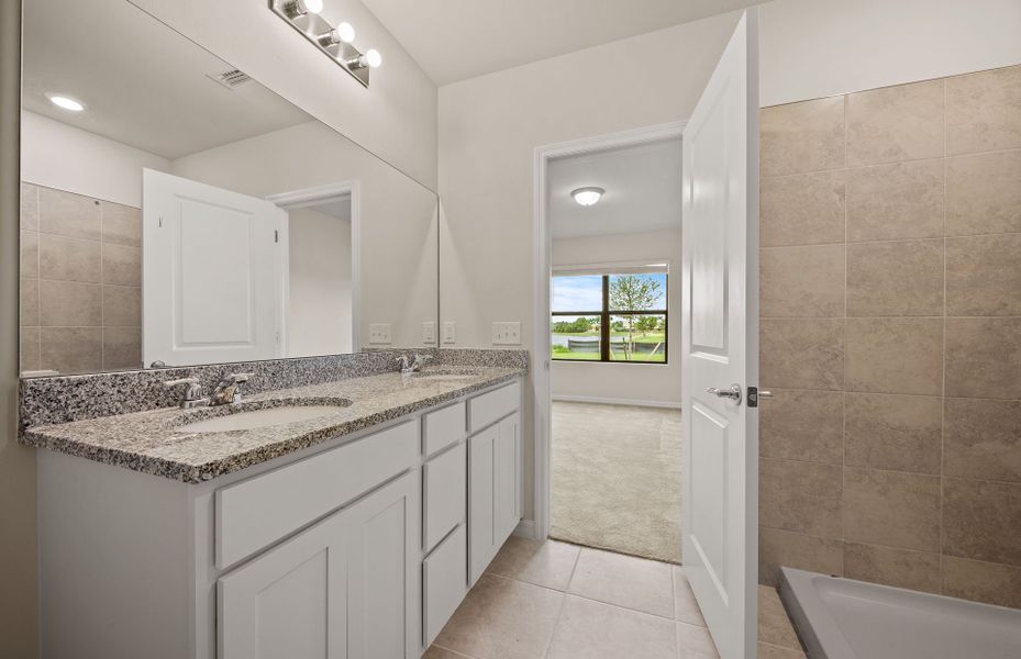 Owner's bathroom with dual sink vanity