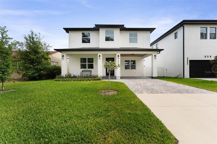 Front exterior of a new home in , Tampa, FL, highlighting curb appeal (Image 1).