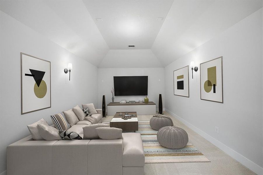 Carpeted home theater room with baseboards and lofted ceiling