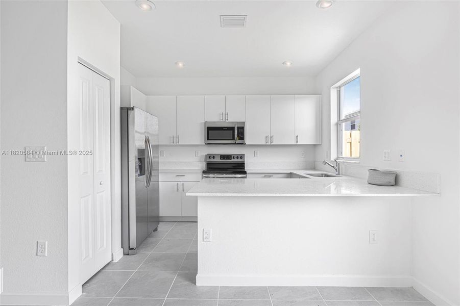 Furnished interior view inside a new home in Cedar Pointe: Cypress Collection, Homestead (Image 11). Furnished interior view inside a new home in Cedar Pointe: Cypress Collection, Homestead (Image 11).