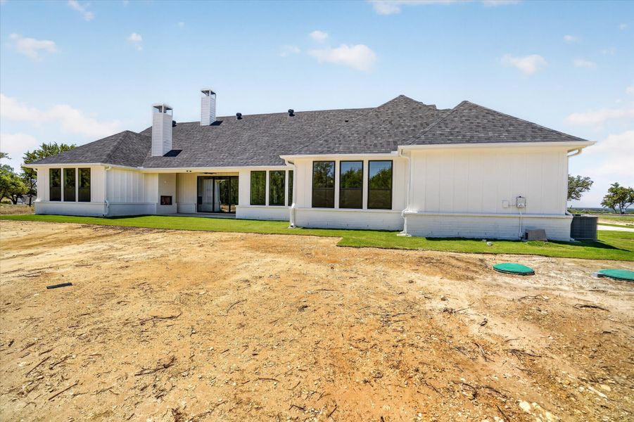 Front exterior of a new home in Timberview Preserves, Weatherford, TX, highlighting curb appeal (Image 21).