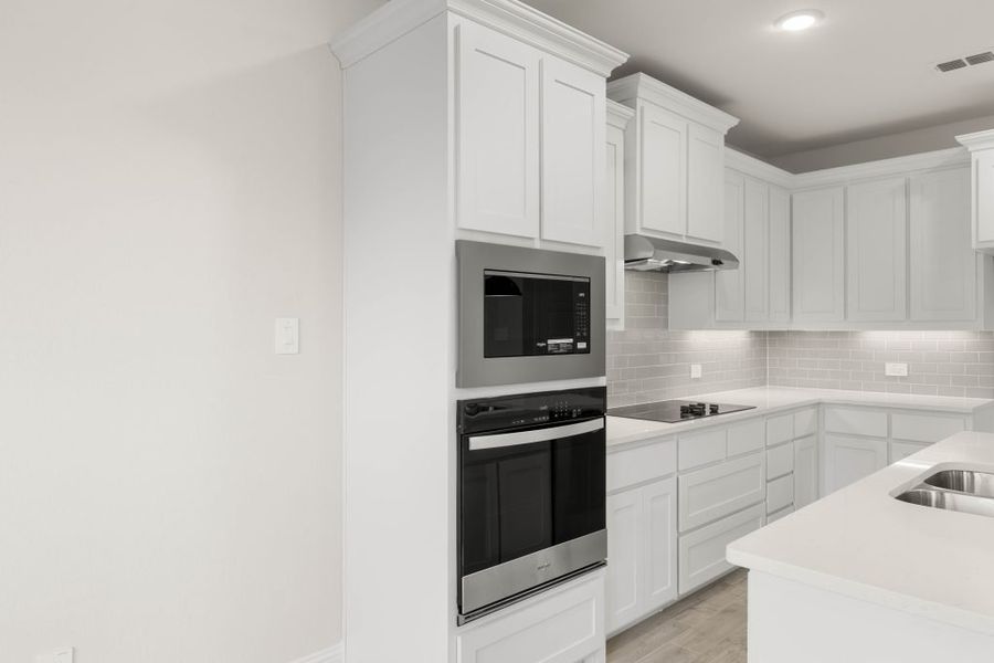 Front exterior of a new home in Main Street Village, Mansfield, TX, highlighting curb appeal (Image 8). Front exterior of a new home in Main Street Village, Mansfield, TX, highlighting curb appeal (Image 8).