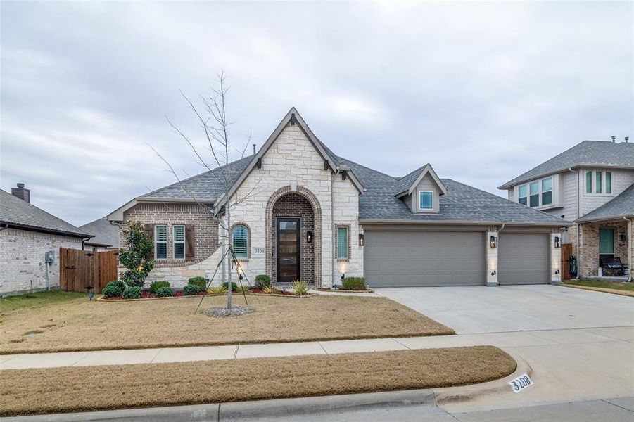 View of front of home featuring a garage