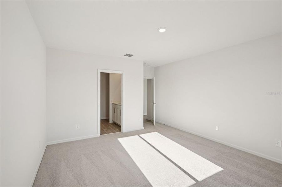 Spacious, unfurnished interior of a new home in The Grove at Stuart Crossing - Classic Series, Bartow (Image 24).