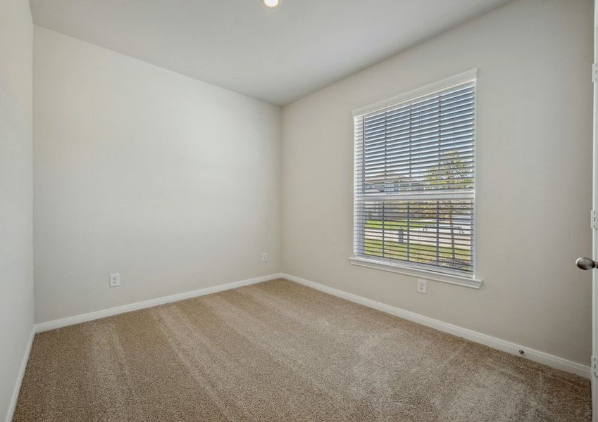 Bedroom with blinds on the window