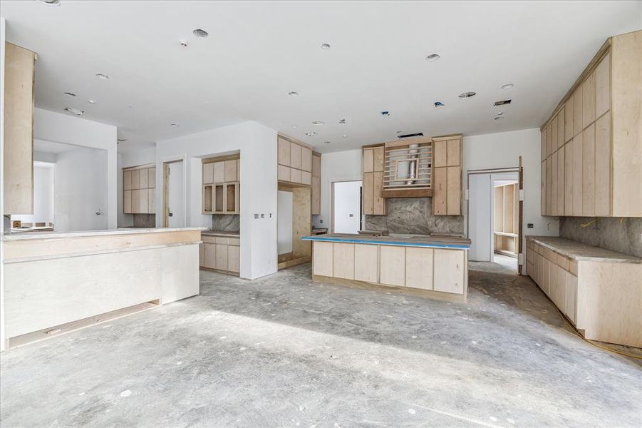 Kitchen, bar, butler's pantry, breakfast area - all open to the family room.  The family room has large retractable doors to open the interior space to the exterior covered patio. Photos will be updated as the progress continues.