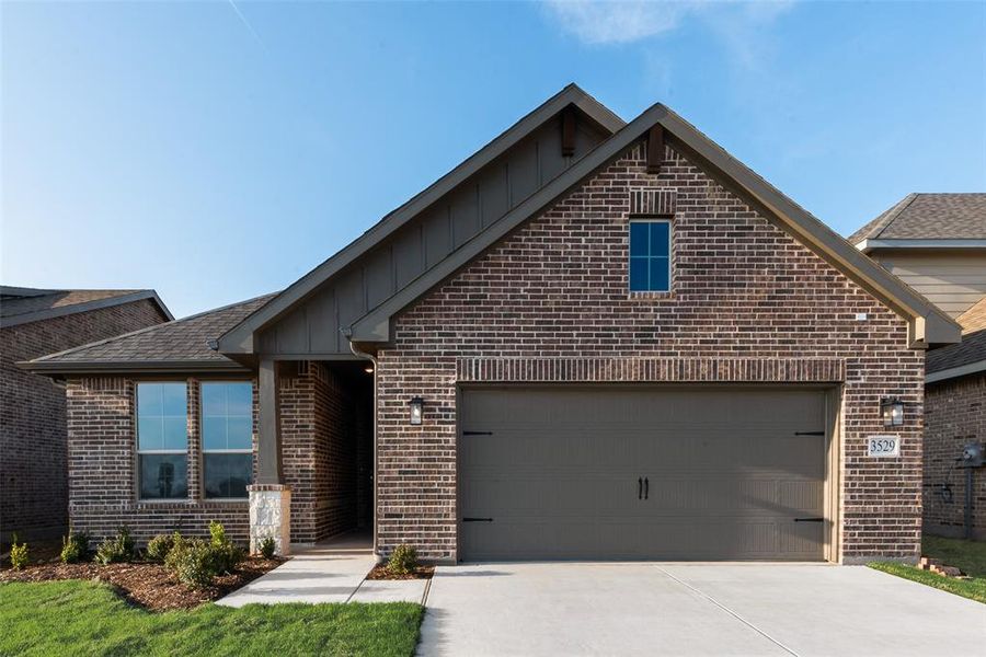 Front exterior of a new home in Liberty Pointe, Gainesville, TX, highlighting curb appeal (Image 2). Front exterior of a new home in Liberty Pointe, Gainesville, TX, highlighting curb appeal (Image 2).