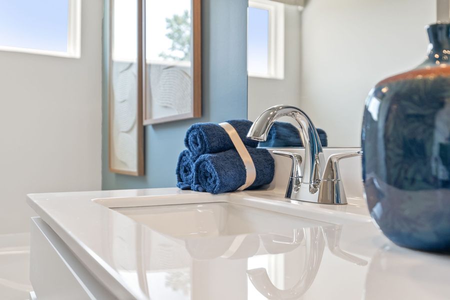 A towel on a sink. A towel on a sink.