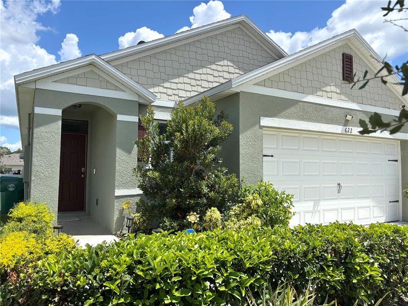 Front exterior of a new home in Victoria Oaks, Deland, FL, highlighting curb appeal (Image 2).