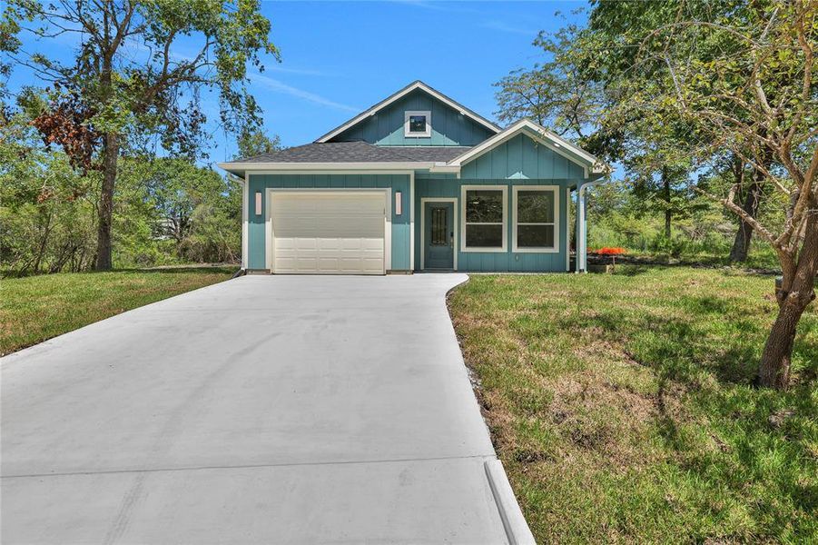 This brand new construction has a one car garage and plenty of driveway parking