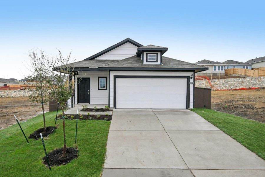 Front exterior of a new home in Cloverleaf, Austin, TX, highlighting curb appeal (Image 20).