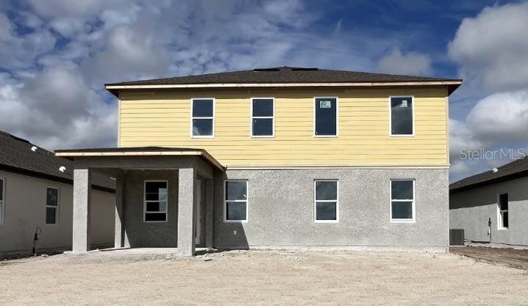 Front exterior of a new home in Hawks Run, Kissimmee, FL, highlighting curb appeal (Image 8).