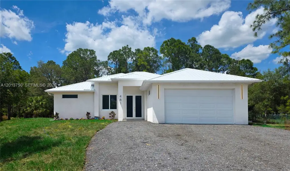 Front exterior of a new home in , Clewiston, FL, highlighting curb appeal (Image 2). Front exterior of a new home in , Clewiston, FL, highlighting curb appeal (Image 2).
