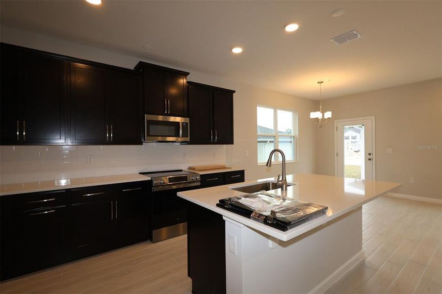 Furnished interior view inside a new home in Emerson Pointe, Apopka (Image 6).