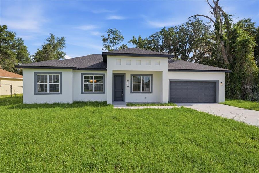 Front exterior of a new home in , Ocala, FL, highlighting curb appeal (Image 21).