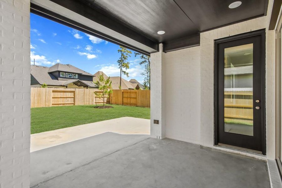 Exterior details and patio area of a home in Evergreen, Conroe (Image 3).
