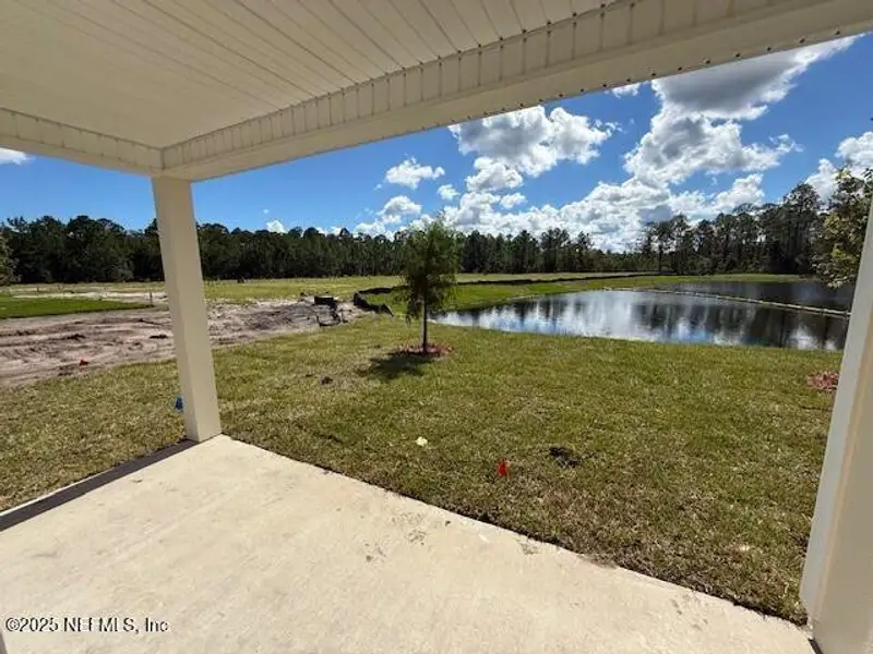 Exterior details and patio area of a home in Grand Reserve, Bunnell (Image 2).